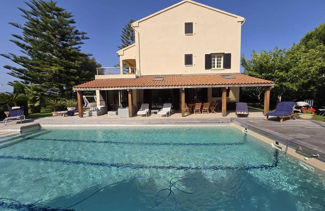 Luxury villa with pool by the sea.