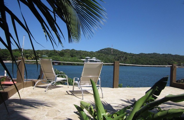 Luxury Waterfront Condo w/Pool, Dock, and Gardens