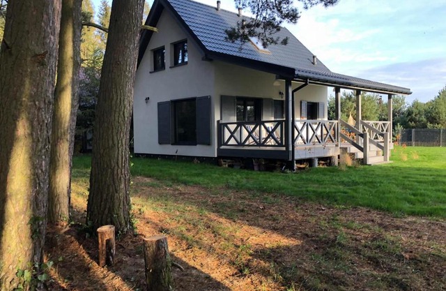 Młyńska Chata - drewniany, całoroczny dom w sosnowym lesie