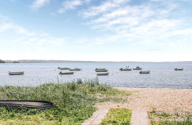 Modern and natural furnished cottage at the popular Følle Strand.