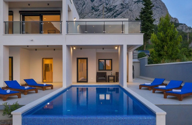 Modern holiday home with infinity pool, three bedrooms, terrace, sea view