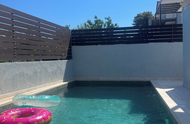 Newly built apartment with a private pool and garden, part of a villa.