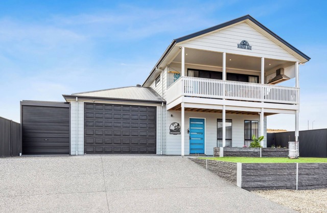 NEWLY BUILT END OF 2024, THIS SPACIOUS RIVER HOME COMFORTABLY ACCOMMODATES 13
