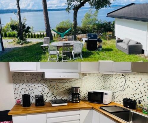 Nice Apartment with1 bedroom Separate living room with a sofa bed and a tiny kitchen a bathroom located in Nordstrand near by the Sea for 3 guests with a garden and grill with sea view just outside the apartment