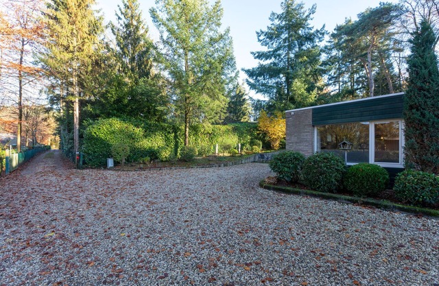 Nice bungalow with washing machine at a holiday park in a natural area