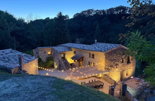 Old mill nestled in greenery in Drôme Provençale, hidden from view