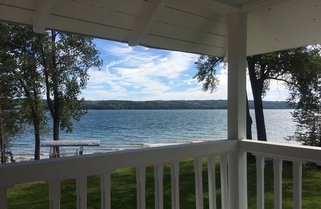 Owasco Lake front seasonal cottage with level yard and beach