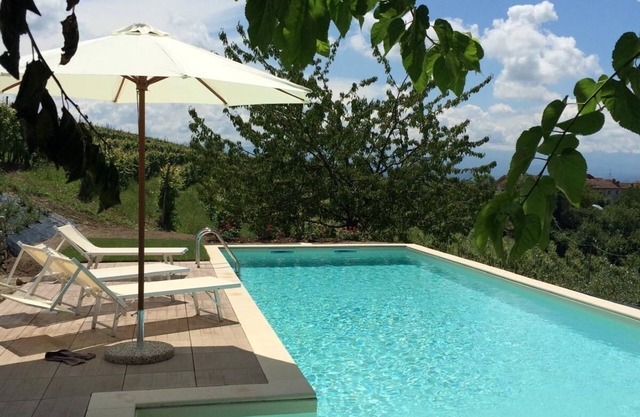 Panoramic villa on the hills of the Langhe among the vineyards large swimming pool