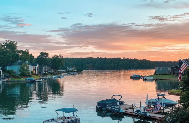 Perfect lakefront oasis! Spacious 5-bedroom home, large dock, screened-in porch.