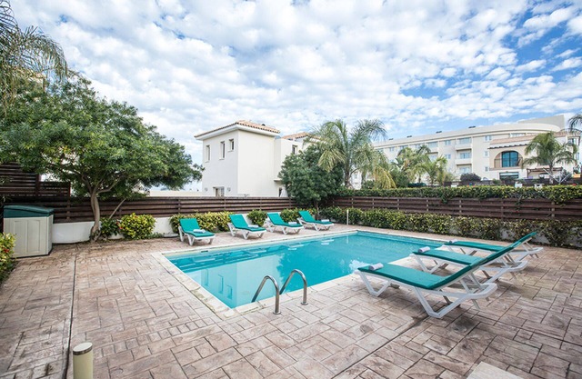 Picture Relaxing Beside Your Private Pool in Protaras Reading Your Favourite Book