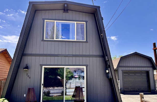 Plug in to the peace, joy, and Zen at this modern Modified A-Frame Cabin!