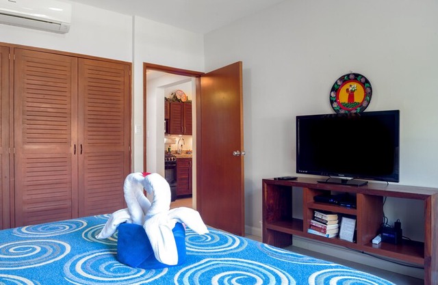 Private balcony overlooking the pool, peaceful apartment with great amenities