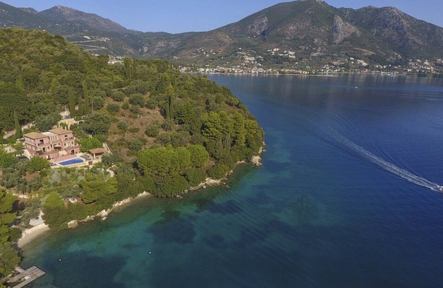 Private waterfront villa with pool and two private beaches