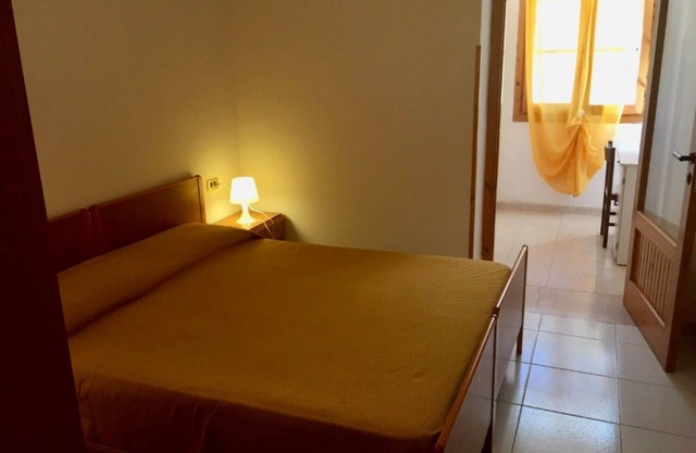 Property in a holiday village 'Baia Falcone-Bilocale 403' with sea view and air conditioning