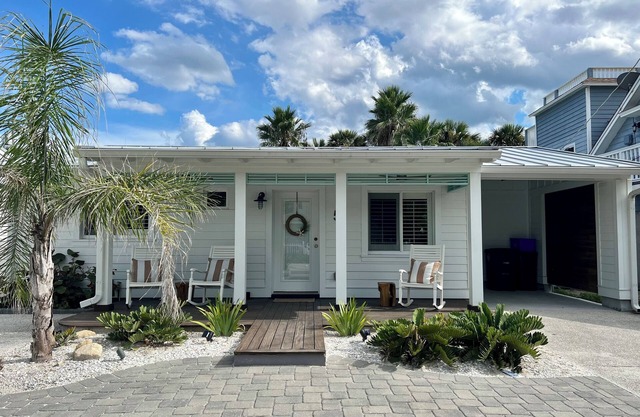 Recently Remastered Beachside Boat House STEPS from the Ocean with HEATED pool.