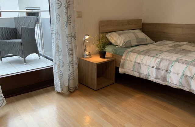 Room for fitters with shared bathroom and balcony