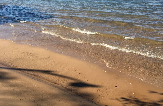 Rustic cozy cabin on a BEAUTIFUL bay of Lake Superior with prime beachfront.