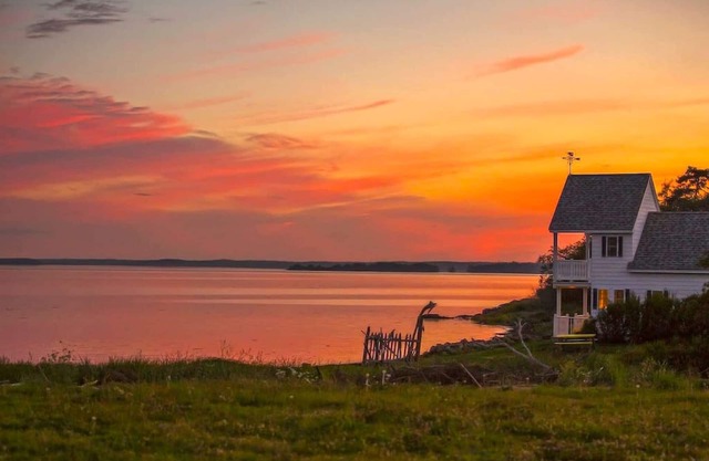 Sea-Breeze Cottage perched on the edge of the bay.
