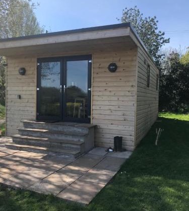Secluded Log Cabin in beautiful private gardens