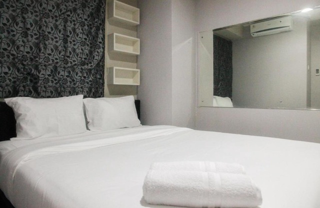 Simply Minimalist 2BR Apartment at Kalibata City Residence By Travelio