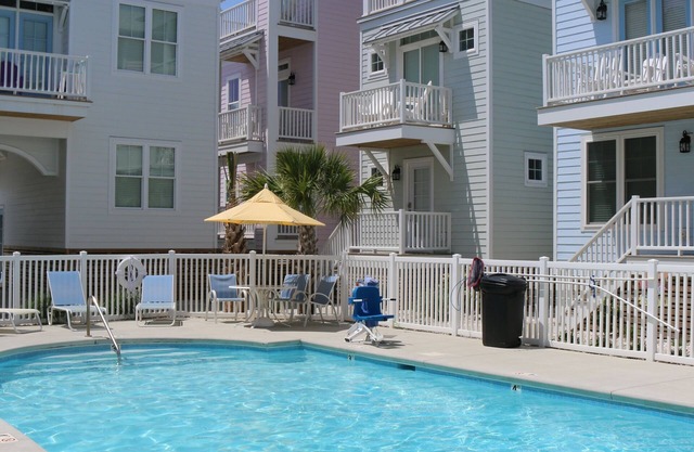 Single Home.Sleeps 7-2 BR/2full baths Overlooks Pool-steps from Beach.