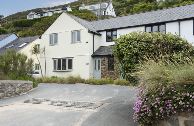 Situated only sixty meters from the Blue Flag sandy beach in the charming coastal village of Porthto