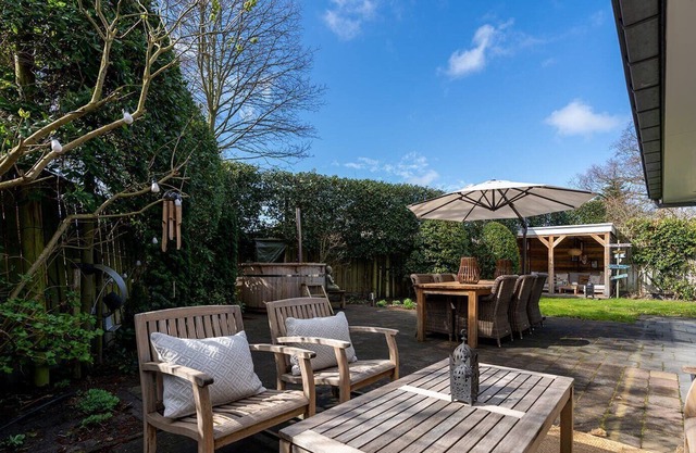 Spacious beach style holiday home with large garden and sauna.