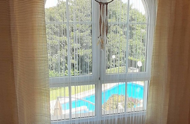 Spacious townhouse in Alicante close to sea and golf with shared sparkling pool.