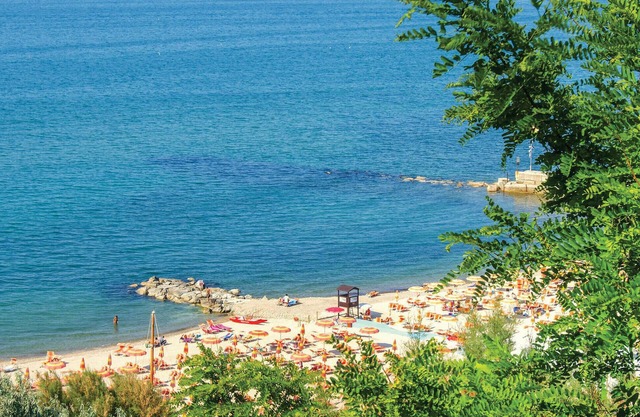 Spacious villa with large veranda and near the beach.