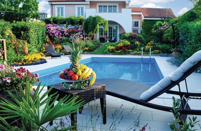 Spend a dream vacation in this exceptionally beautiful vacation home with a beautifully landscaped g