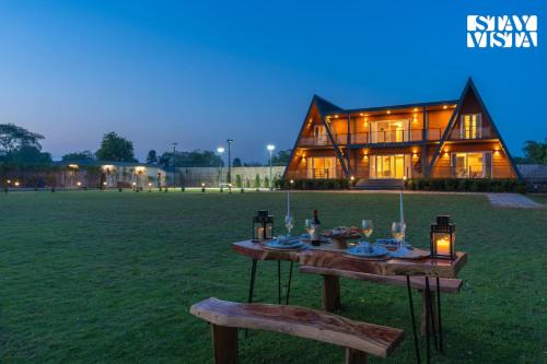 StayVista at Aarna Estate with library, lawn