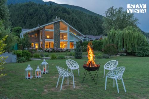 StayVista at The Nestled North with Bonfire, lawn