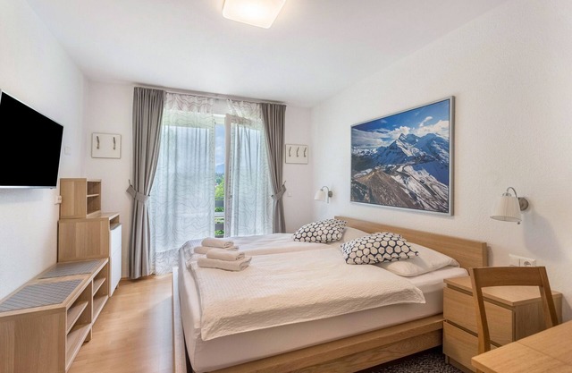 Studio Apartment 'Haus Melanie -' with Mountain View, Shared Garden and Wi-Fi