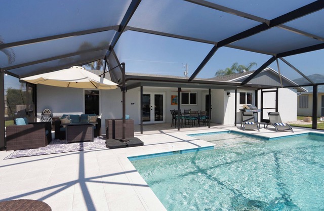 Stunning southern exposure Gulf-access canal home with a bright, airy feel - Shore Beats Work