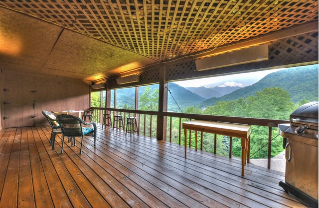 Stunning views, cabin with 2 master suites, large deck, wood burning fireplace.