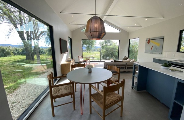 Sunlight filled retreat on acres of organic orchards with mountain views.