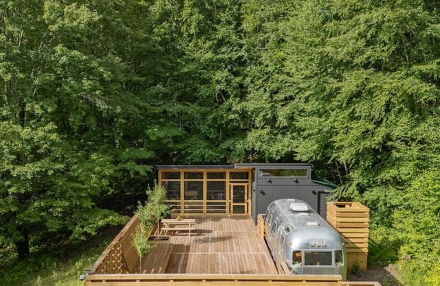 Sunlit Airstream in Trees with Expansive Deck + Nature Views