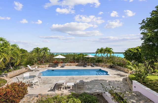 The Pink House vacation rental, magnificent pool and view over Elizabeth harbor