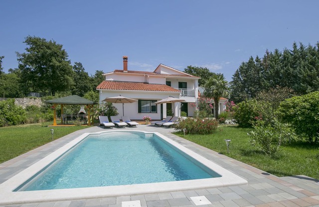 This 4-bedroom villa for up to 9 guests is located in Labin and has a private swimming pool, air-con