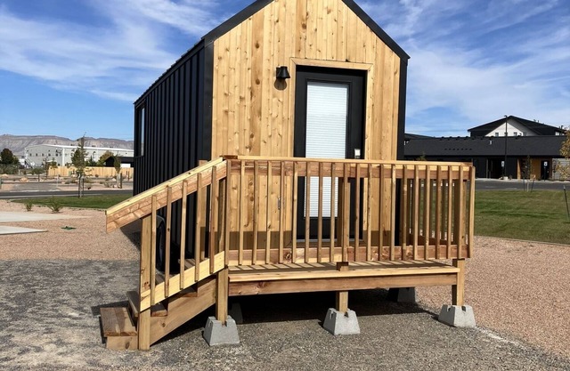Tiny home with one queen bed on main floor.