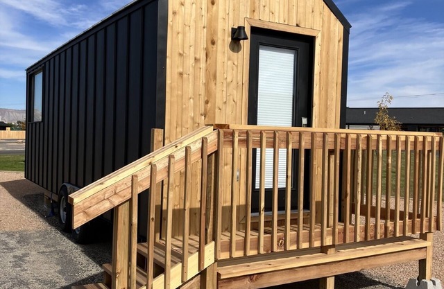 Tiny home with one queen bed on main floor.