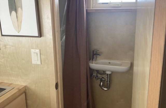 Tiny home with one queen bed.