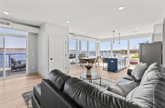 Top floor end unit with covered porch overlooking Lake Pepin - Assigned Garage - Unit 305