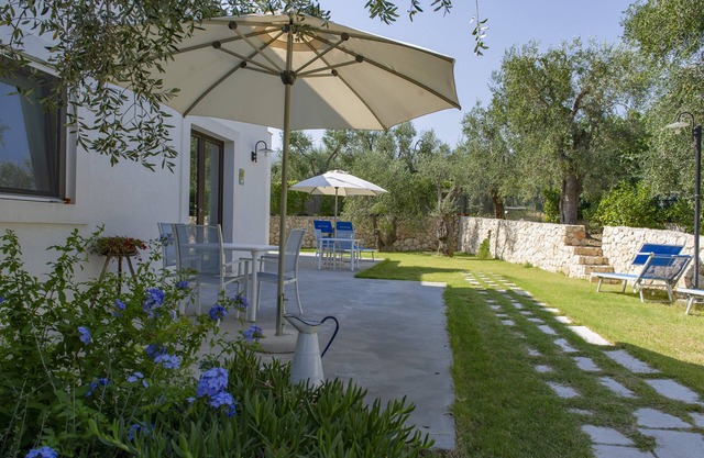 Tranquility and comfort among ancient olive trees, near the sea.