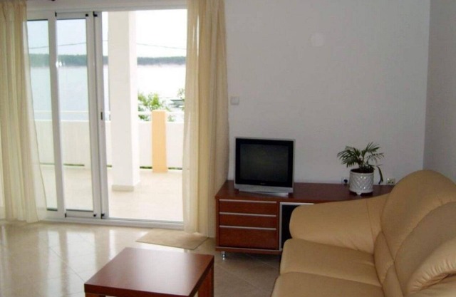 Two bedroom apartment with terrace and sea view Barbat, Rab (A-22053-a)