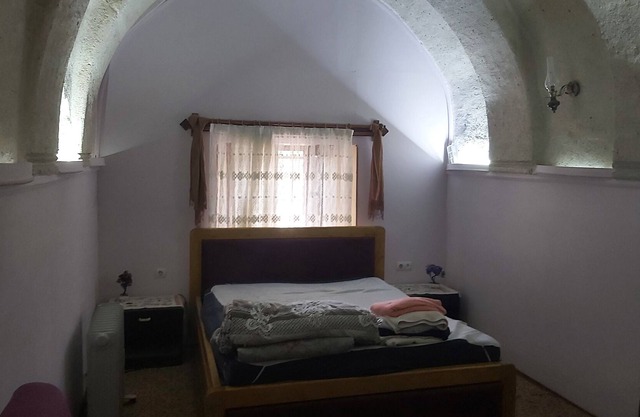 Typical stone house with arches