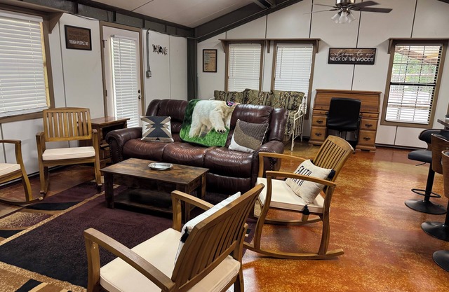 Unique camp style house with large wrap around deck.