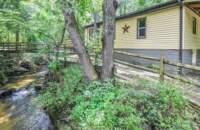 Unique creekside property with hot tub and fire pit