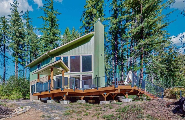 Unique riverfront home + cabin with amazing views, deck, & W/D - dog-friendly