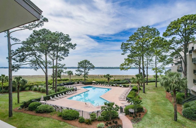 Updated & Gorgeous End Unit with Spectacular Views of Pool & Sound. South Beach Oasis Awaits you!